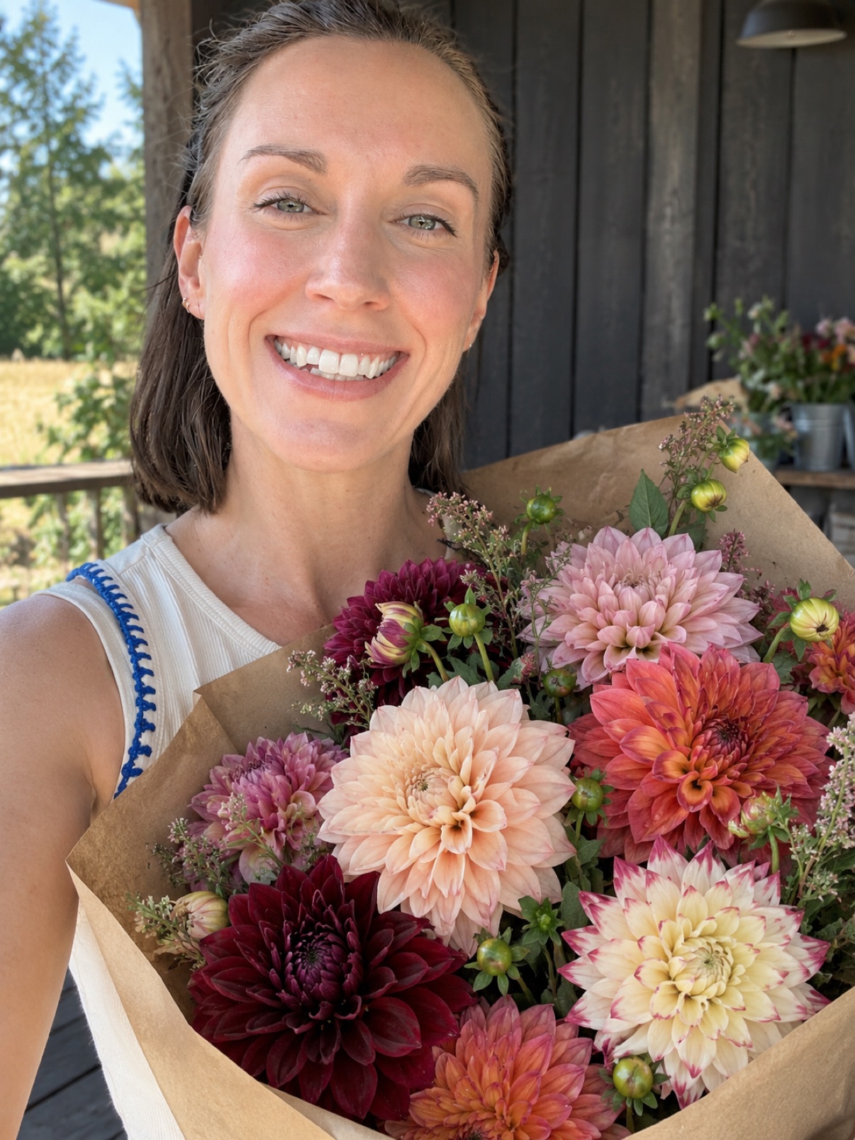 Alesia holding a bouquet of her dahlias